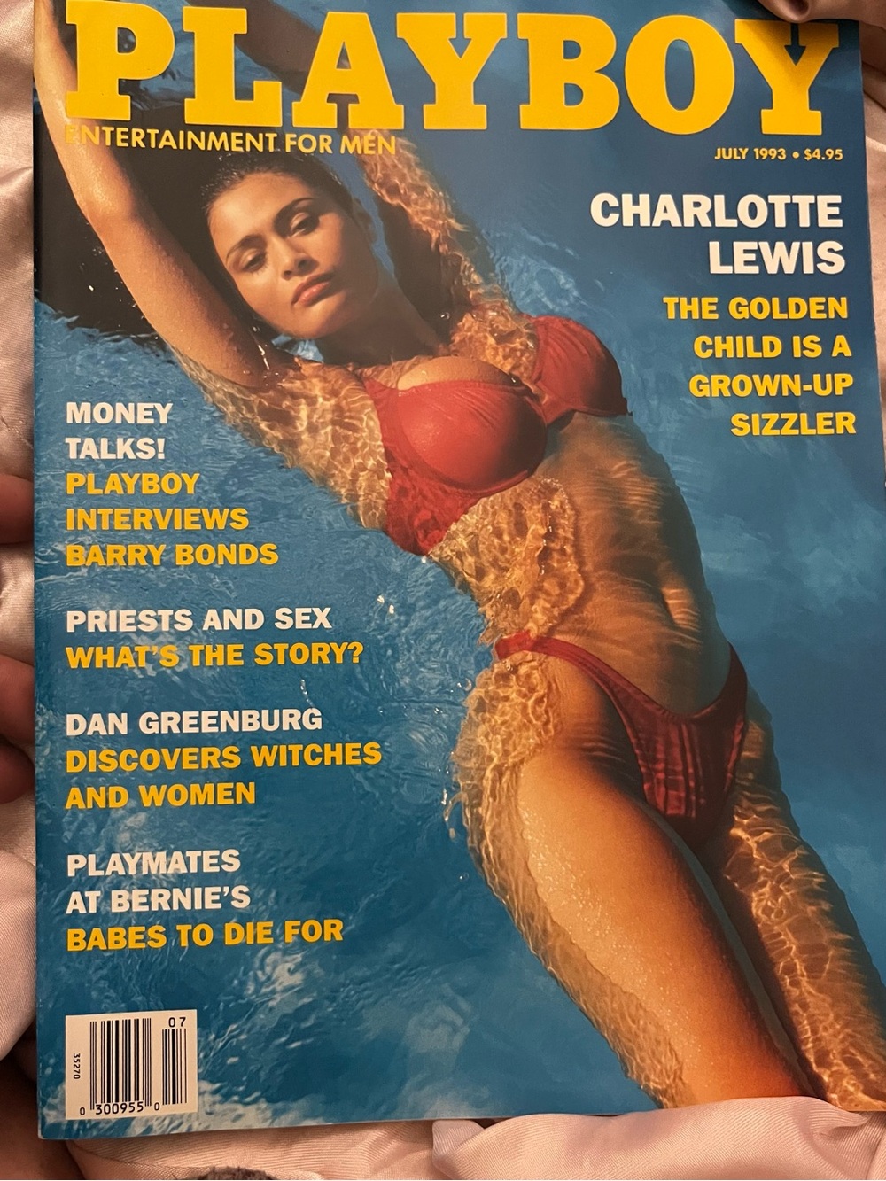 PLAYBOY Magazine Cover Featuring Model in Red Bikini and Yellow Logo
